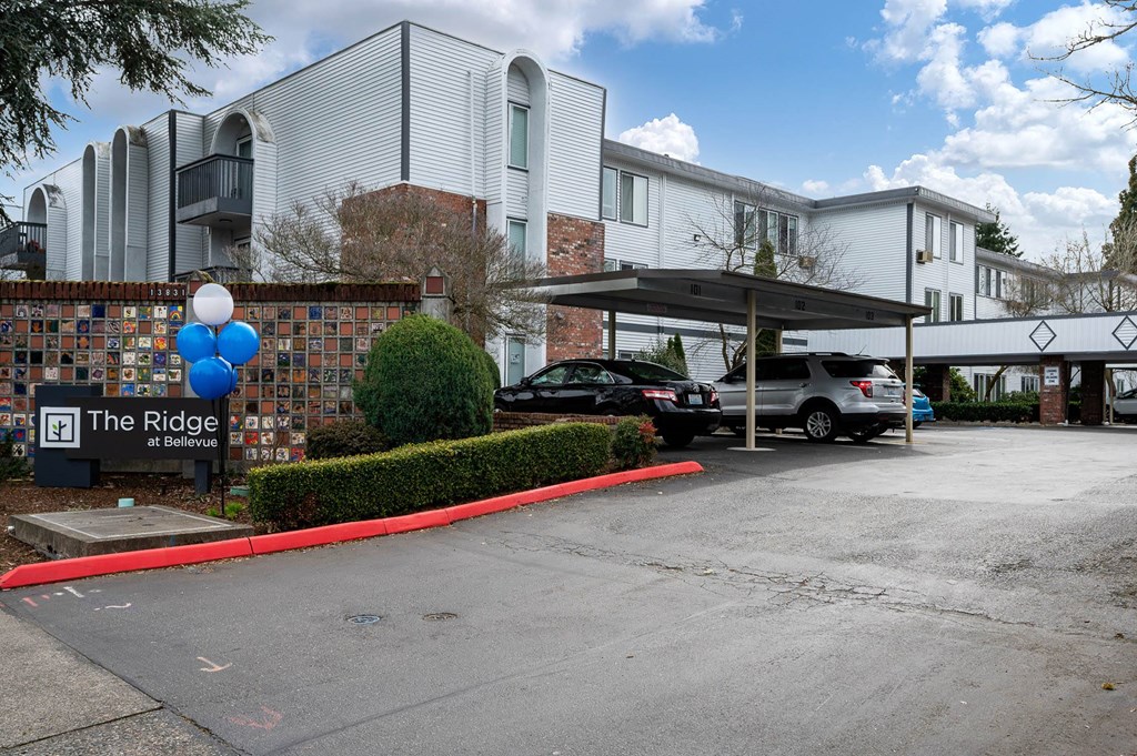 the ridge condominiums building entrance and parking lot